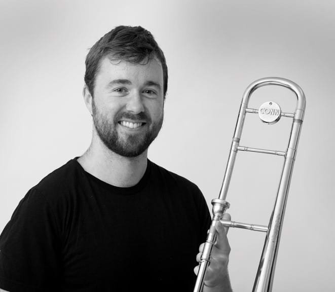 Nick Mahon holding a trombone
